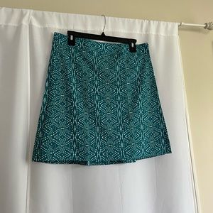 Rip Skirt Hawaii wrap skirt. Turquoise print, size M, velcro closure.